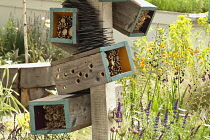 Chelsea Flowershow 2009, Future Nature garden designed by Ark Design. Boxes providing insect habitat and shelter in foreground and drought tolerant planting.