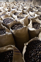 West Indies, Windward Islands, Grenada, Sacks of dried nutmegs in the Gouyave Nutmeg processing factory.