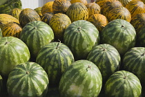 Turkey, Aydin Province, Kusadasi, Fresh green and yellow striped melons delivered to the head chef at Hotel Ladies Beach.