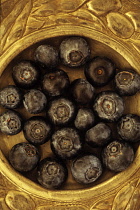 Blueberry,  Vaccinium corymbosum Royal Blue 1. Looking down  on Blueberries lying in ornate pewter plate.