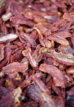 Tomato, Lycopersicon esculentum, Mass of red sun dried tomatoes.