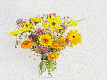 Studio shot of summer flowers in glass jar, Artistic textured layers added to image to produce a painterly effect.