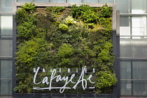 Germany, Berlin, Mitte, Vertical planting on the exterior of Galeries Lafayette on Friedrichstrasse.