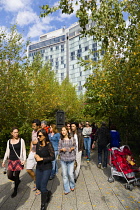 USA, New York, Manhattan, people walking in The Gansevoort Woodland on the High Line a linear park on an elevated disused railroad called the West Side Line. USA, New York State, New York City.