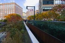 USA, New York, Manhattan, 14th Street entrance to the High Line linear park on an elevated disused railroad spur called the West Side Line with plants in autumn colours. USA, New York State, New York...