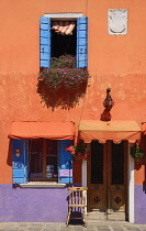 Italy, Veneto, Burano Island, Colourful row of house facades. Italy, Veneto, Venice.