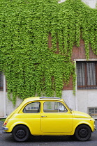 Italy, Lazio, Rome, yellow Fiat 500 'Bambini'.